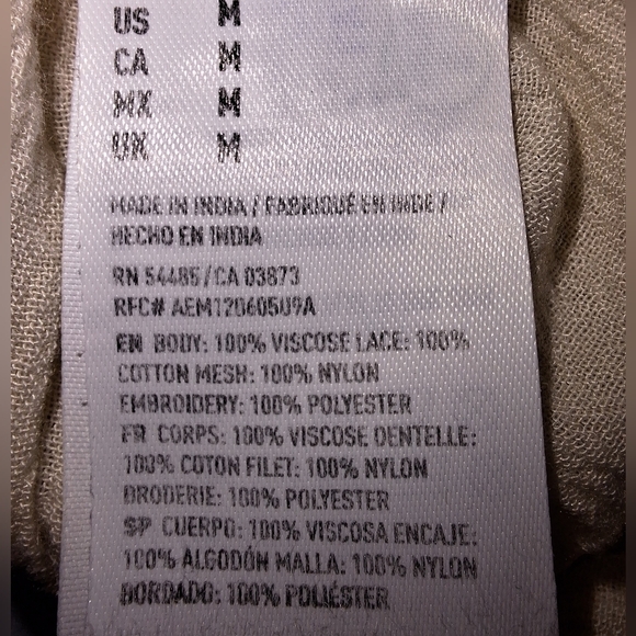 An American Eagle sheer and lace low-cut blouse in a size medium. - Picture 5 of 9